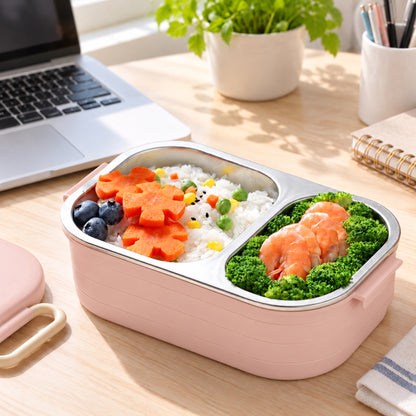 Lunch box rose en inox avec saumon et brocolis sur un bureau